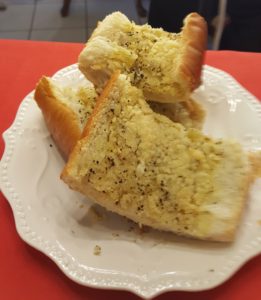 A white plate topped with two pieces of cake.