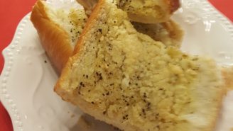 A white plate topped with two pieces of cake.