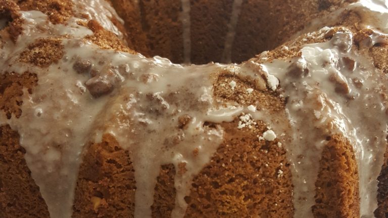A bundt cake with icing on top of it.