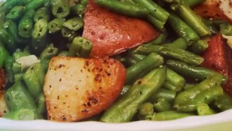 A bowl of green beans, potatoes and asparagus.