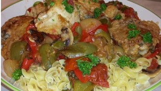 A plate of food with pasta and vegetables.