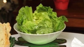 A bowl of lettuce on the table