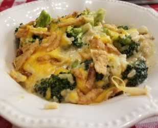 A white plate topped with broccoli and cheese.