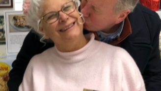 A man kissing an older woman on the cheek.